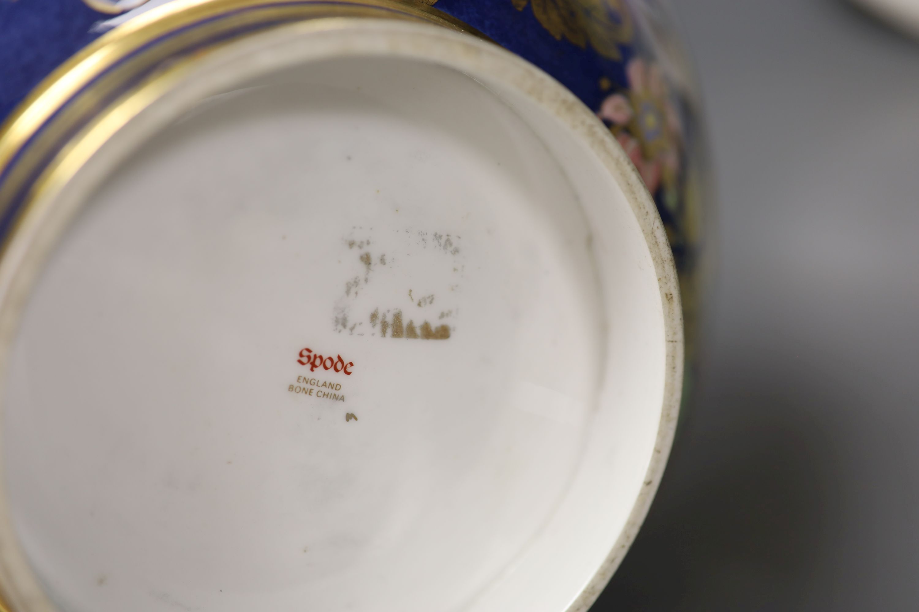 A Spode blue ground bowl, diameter 26cm, two cabinet plates painted with a floral bouquet and a Berlin KPM blue and white vase (4)